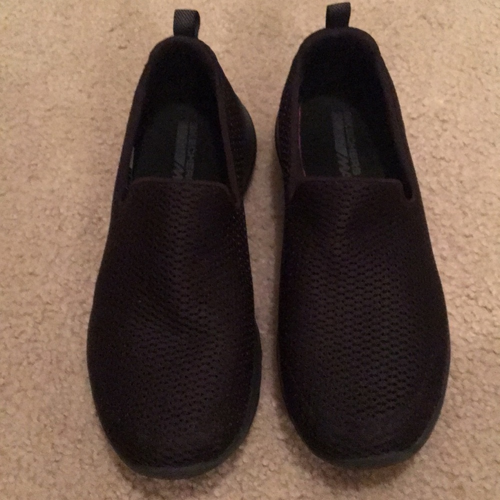 Black sketchers slip on